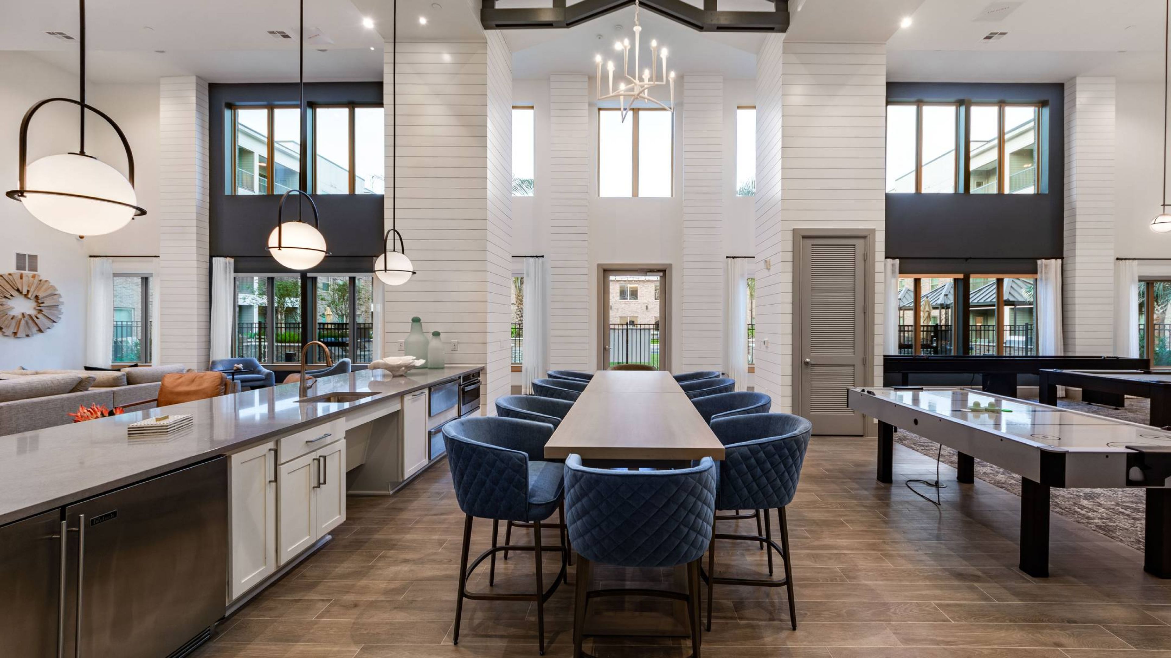 Hawthorne at Fairmont clubhouse with community kitchen, dining area, and games.