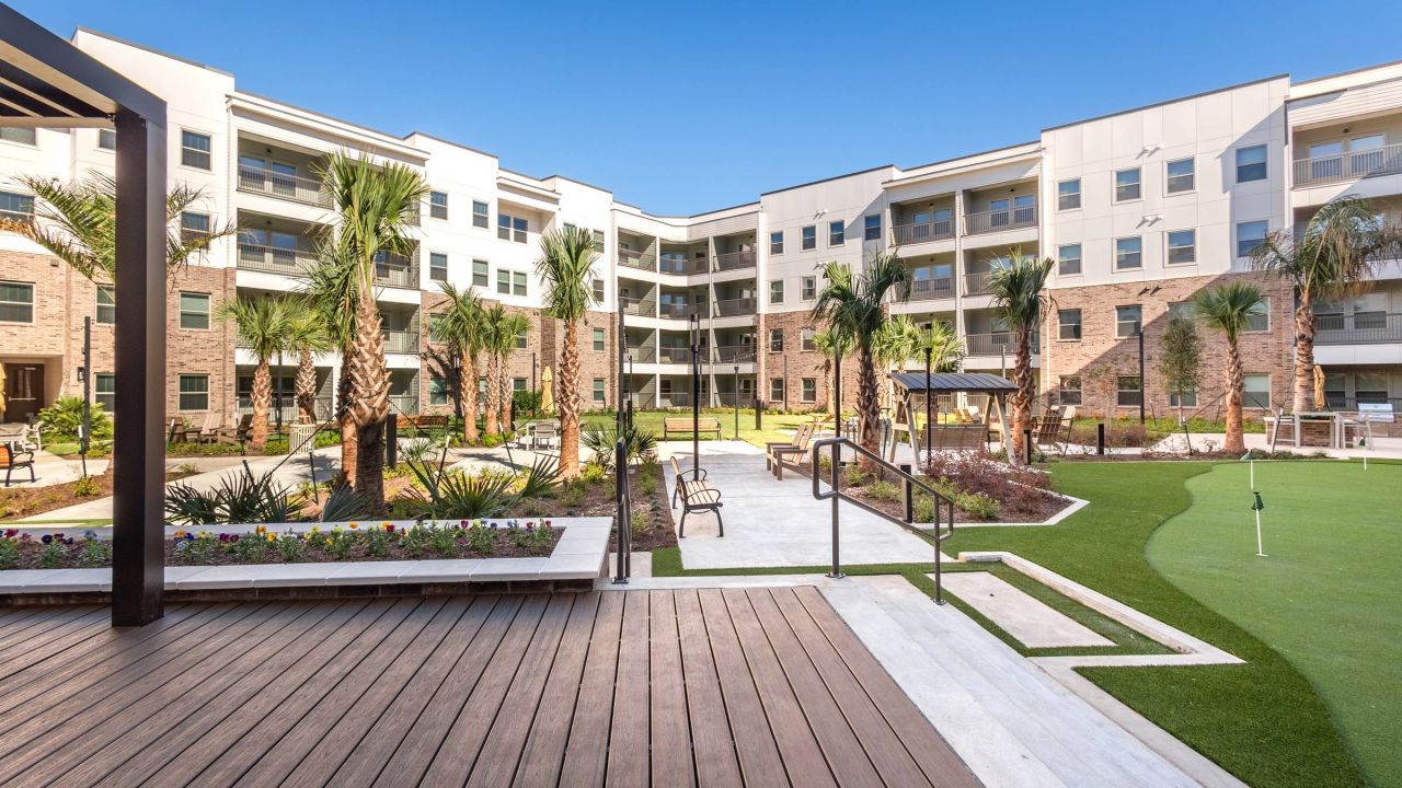 Hawthorne at Fairmont outdoor courtyard with green space and pool with beautiful landscaping