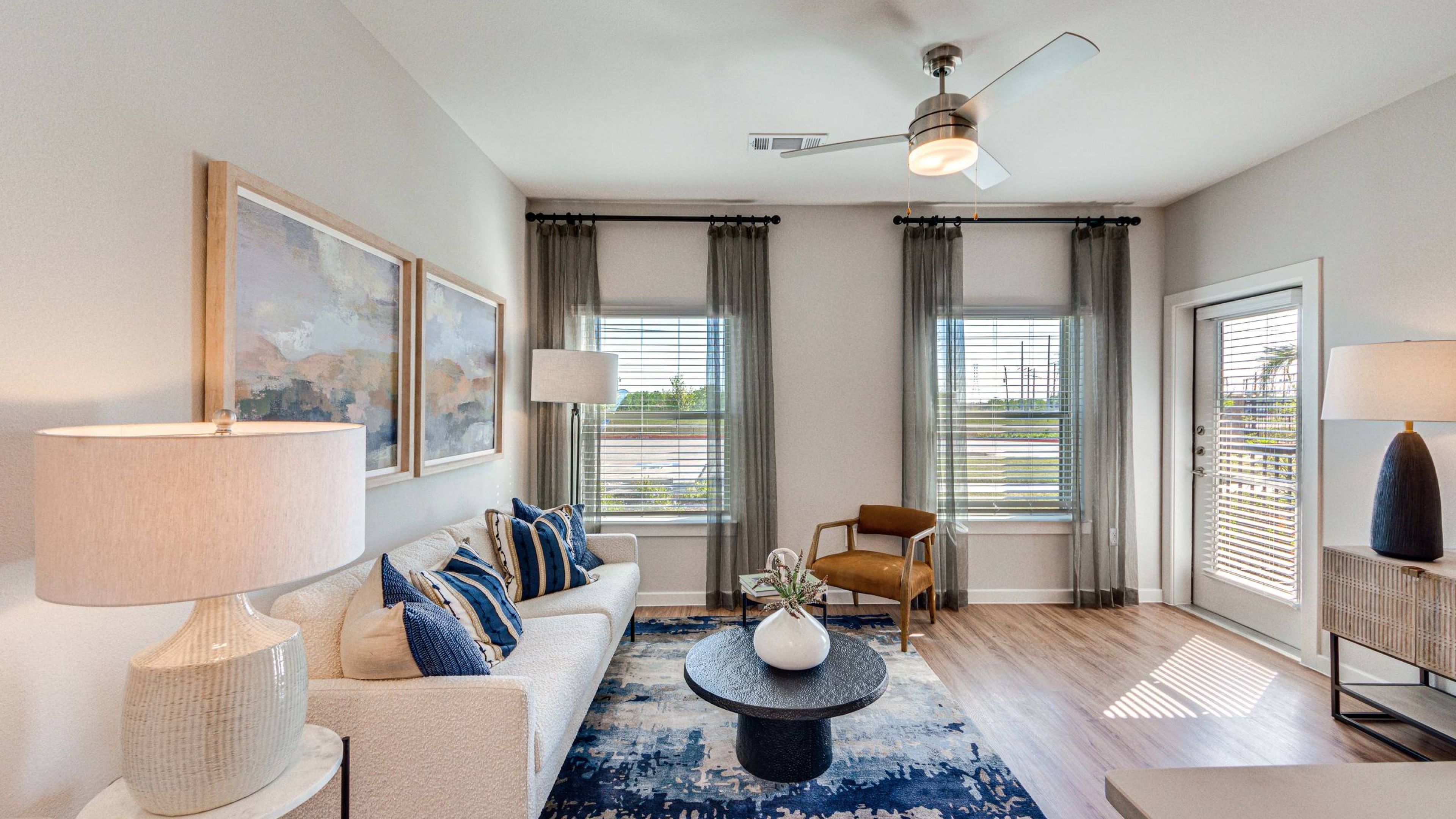 Hawthorne at Fairmont luxury apartment kitchen with stand-alone island, custom cabinetry, and designer tile backsplash